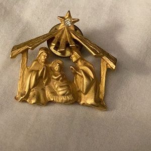 Petite Gold Tone Nativity Lapel Pin.